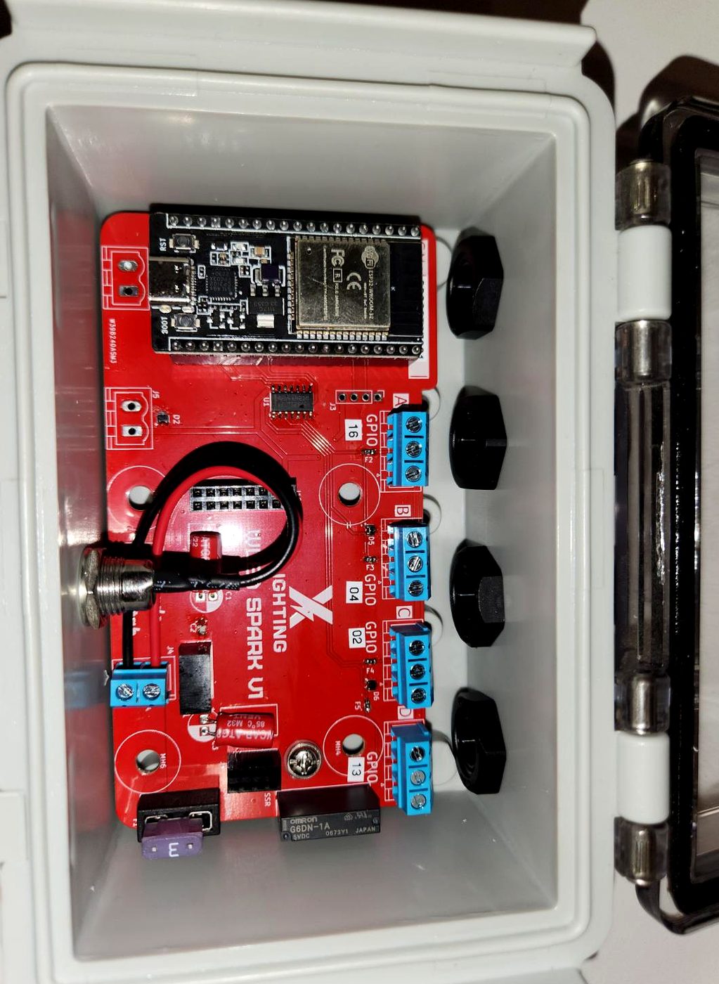 X Lighting Spark V1 board — ESP32, four channel terminals, and power-saving relay